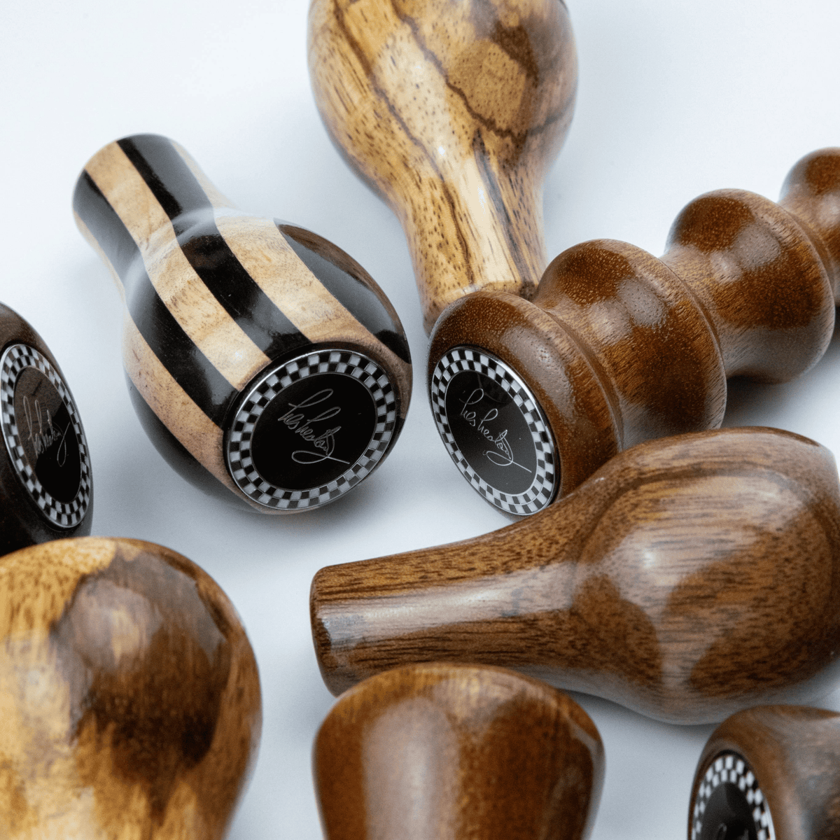 Close up of Les Leston Slipstream wooden gear knob showing the contrasting maple and ebony striped grain and handcrafted finish for classic sports cars, GT cars and historic racing vehicles