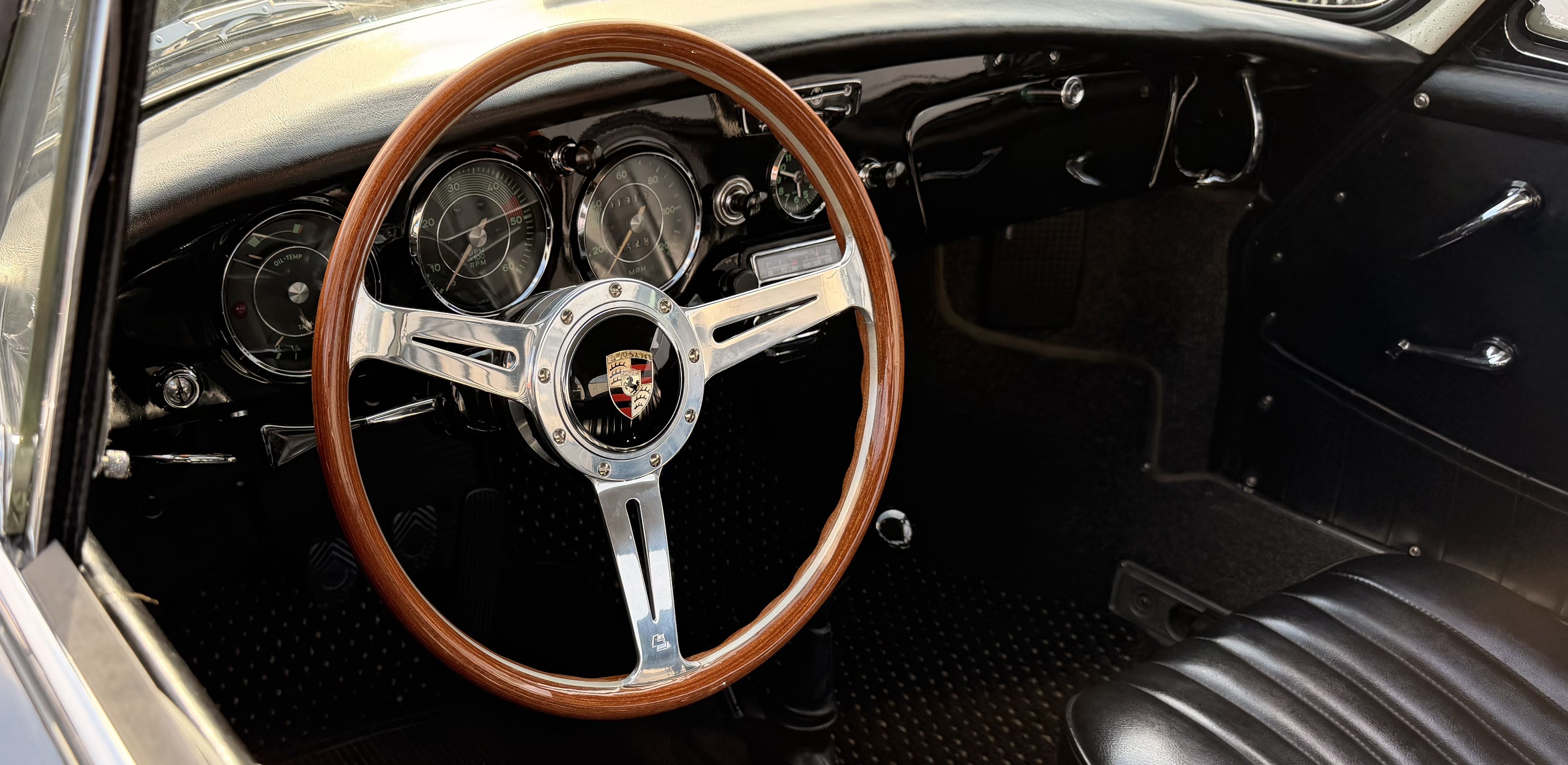 Les Leston 14-inch dished steering wheel with Porsche horn button fitted inside a classic Porsche 356 interior