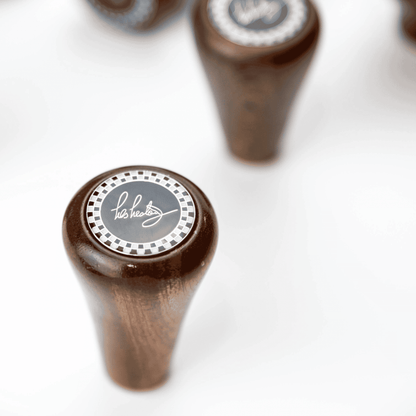 Close up of Les Leston Chevron mahogany wooden gear knob showing the triangular profile, rich wood grain and handcrafted finish for classic sports cars, GT cars and historic racing vehicles