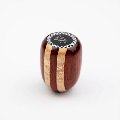 Front view of Les Leston Dadio wooden gear knob handcrafted in England from alternating maple and red hardwood with a distinctive striped finish for classic sports cars, GT cars and historic racing vehicles