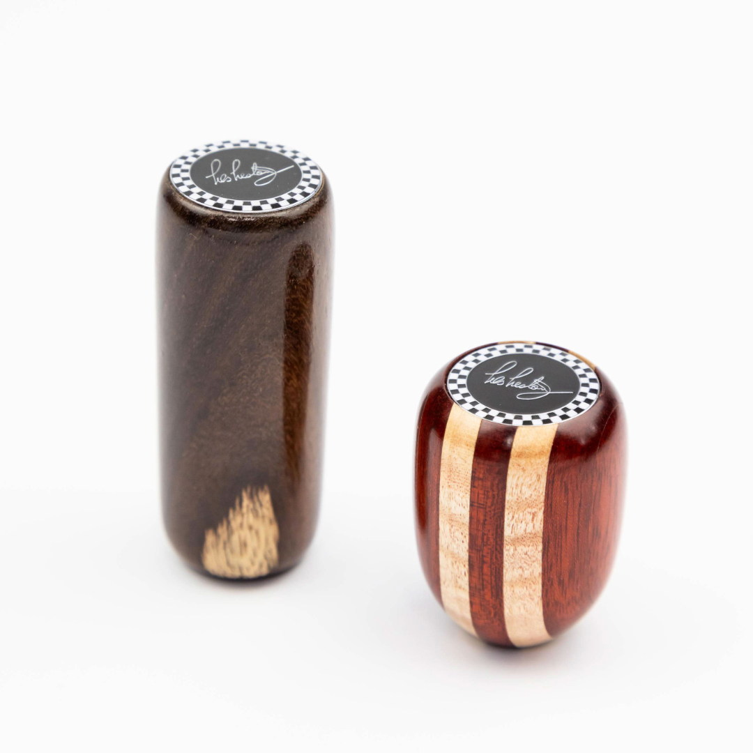 Close up of Les Leston Dadio wooden gear knob showing the contrasting maple and red hardwood striped grain and handcrafted finish inspired by the famous Dadio Lotus Elite