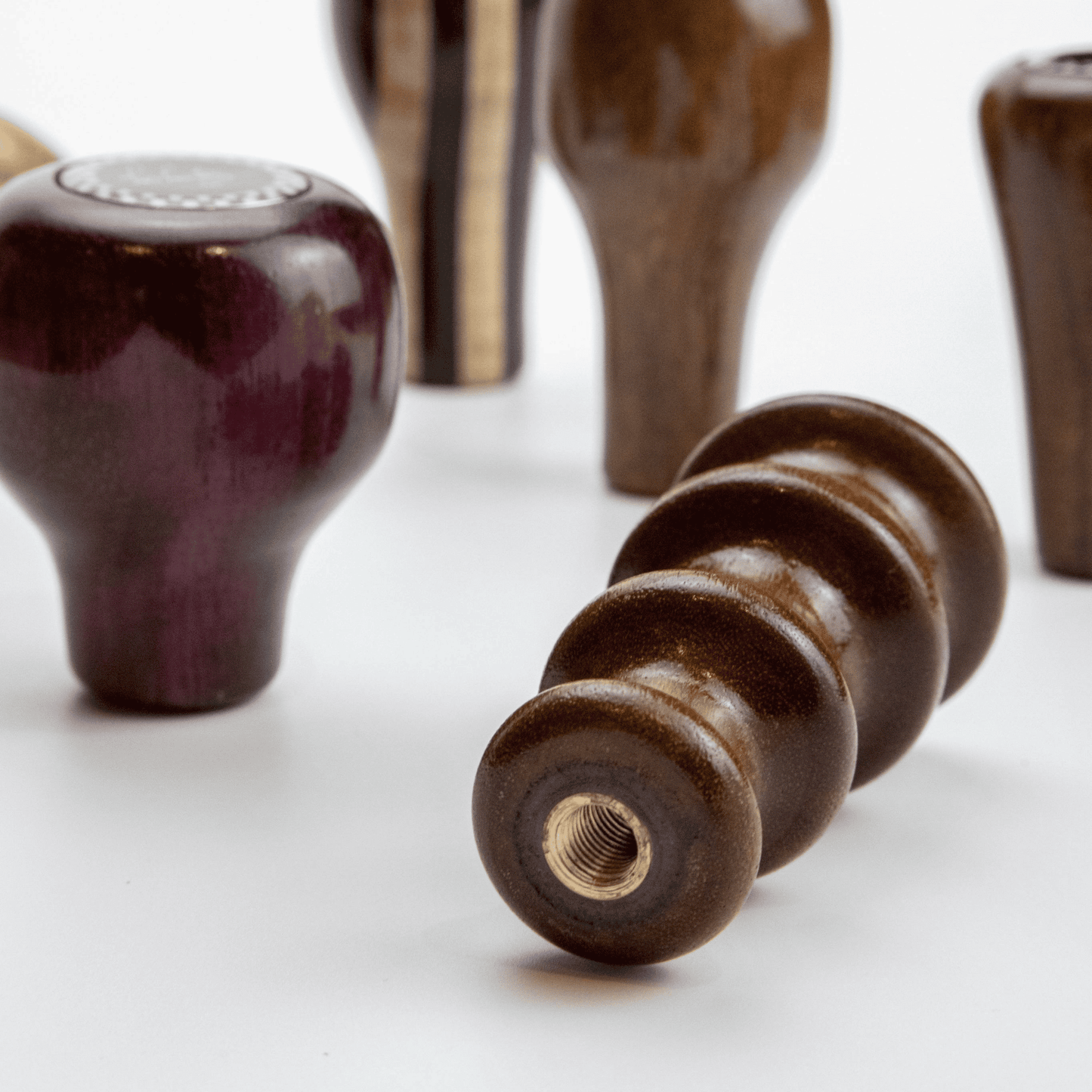 Close up of Les Leston Fingertip wooden gear knob showing the hand carved finger grooves, tall profile and handcrafted finish inspired by an original Les Leston design