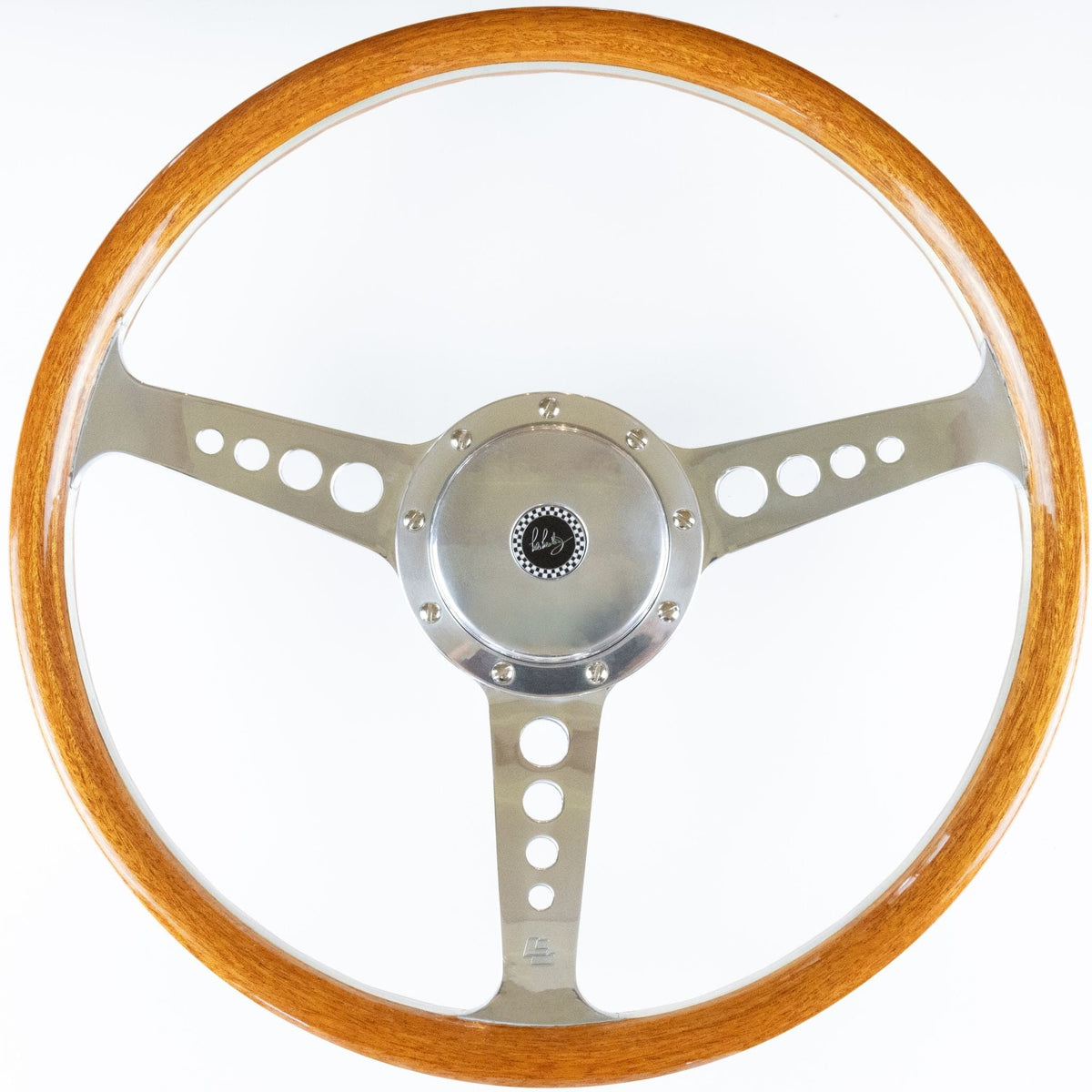 Front angle view of Les Leston Grand Prix Mk5 wooden steering wheel with billet centre and Les Leston enamel badge