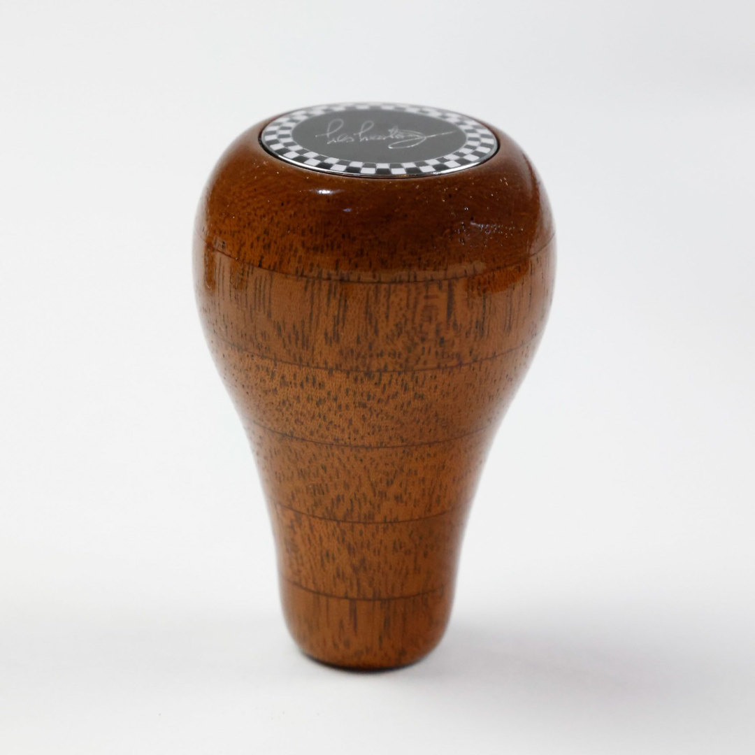 Front view of Les Leston Mahogany Stripe wooden gear knob handcrafted in England from layered mahogany with a distinctive striped grain for classic sports cars, GT cars and historic racing vehicles