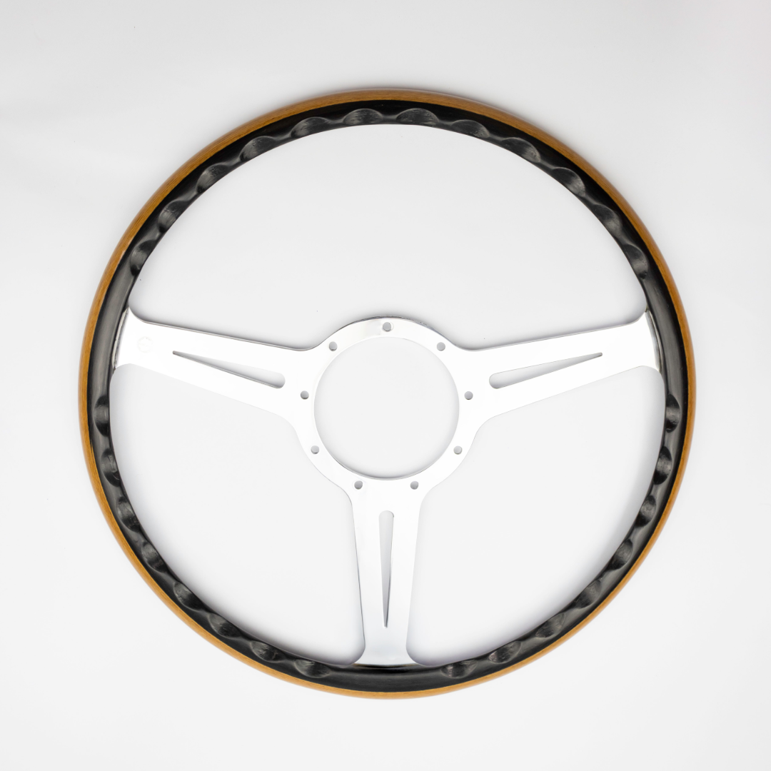 Close up of Les Leston Monte Carlo steering wheel showing the contrasting black oak and teak wood rim and handcrafted finish