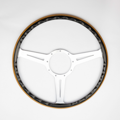 Close up of Les Leston Monte Carlo steering wheel showing the contrasting black oak and teak wood rim and handcrafted finish