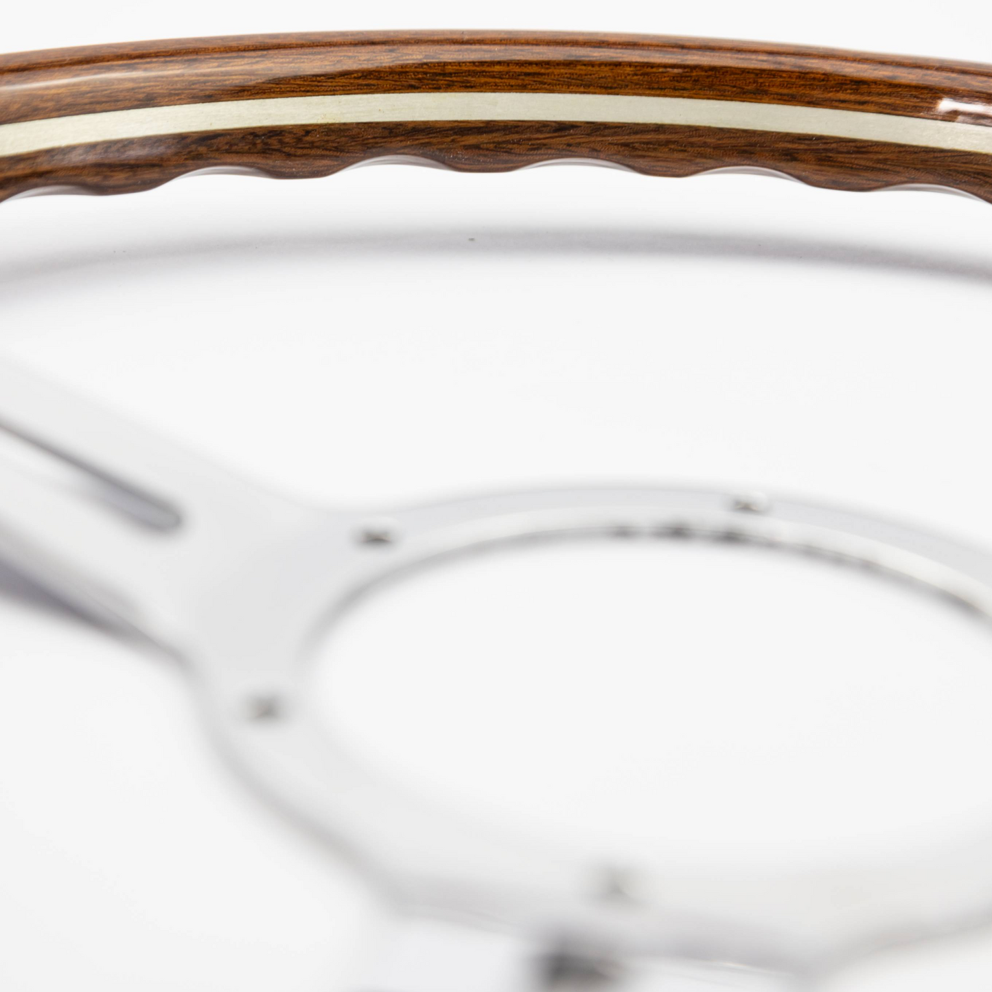 Close-up of mahogany wood rim on Les Leston Monte Carlo steering wheel showing natural grain and hand-finished surface