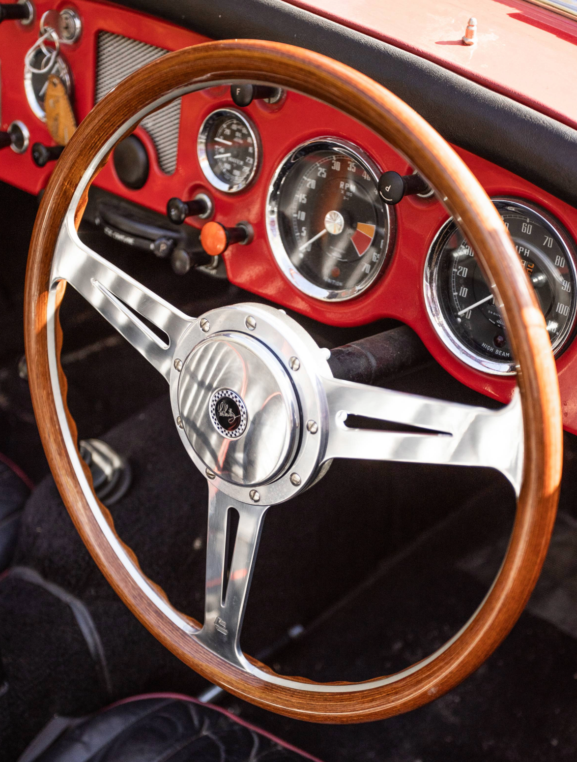 Les Leston Monte Carlo steering wheel fitted inside a classic MGA sports car interior showing period-correct vintage styling