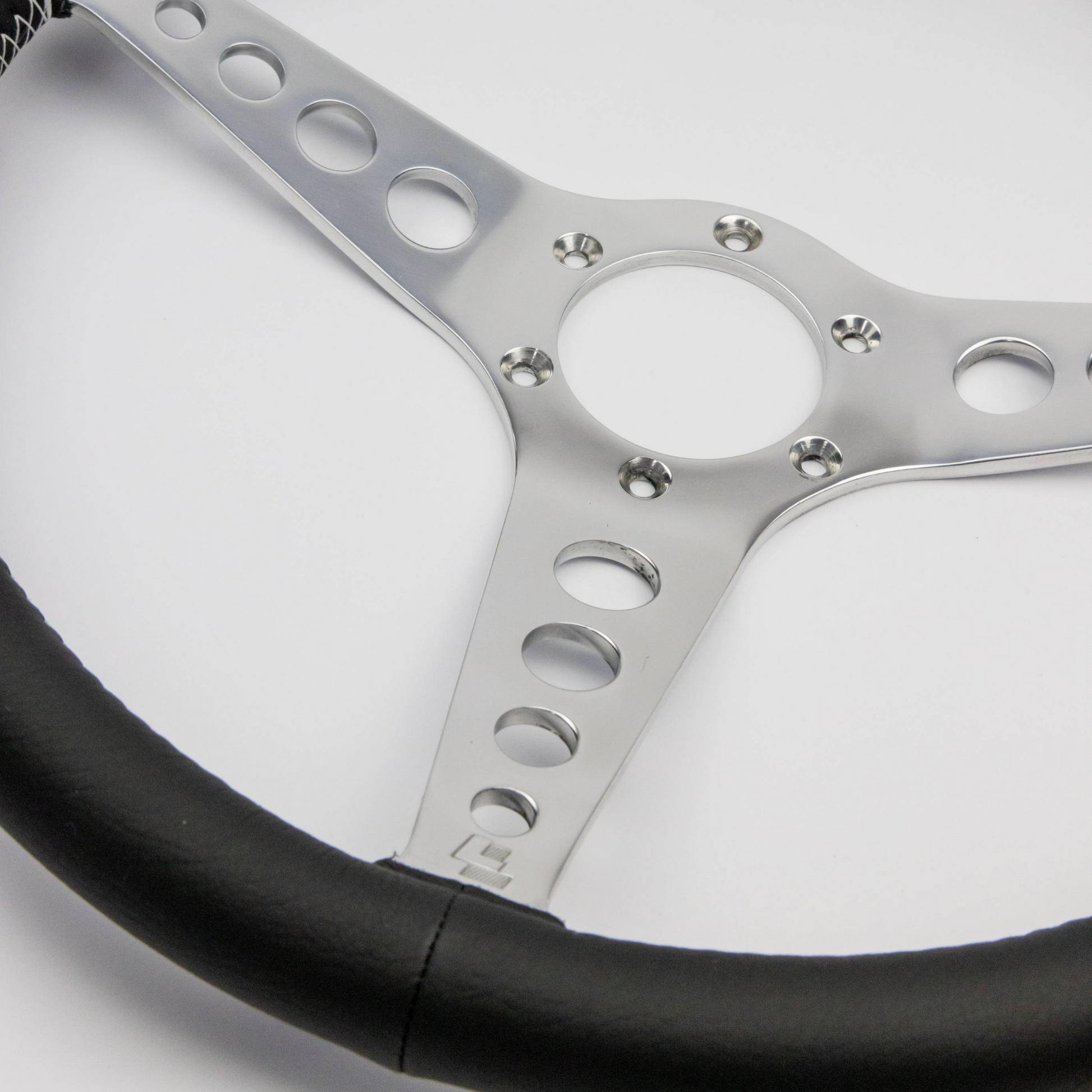 Side profile of a Les Leston 14-inch dished leather steering wheel showing the dish depth