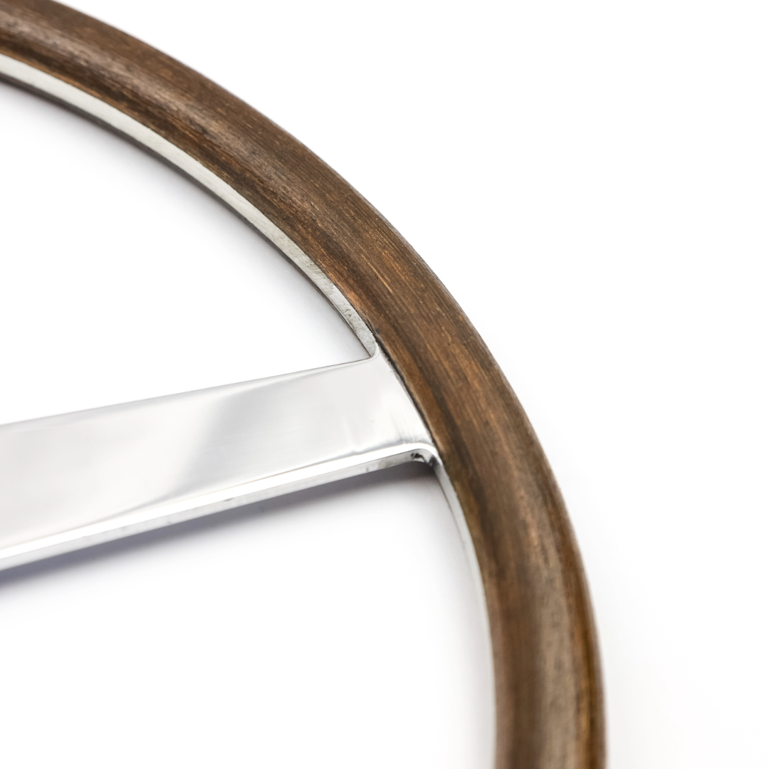 Close up of the mahogany wood rim on the Rene 4 Spoke steering wheel showing the hand aged patina, Danish oil finish and period correct craftsmanship inspired by original 1920s Rene Thomas steering wheels