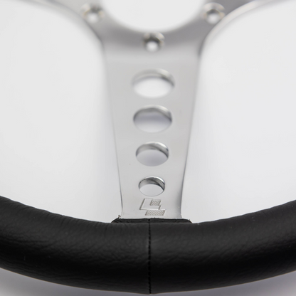 Close-up of the hand-finished black leather rim on a Les Leston 14-inch dished steering wheel
