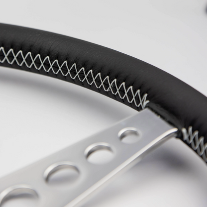 Close-up of the hand-finished black leather rim on a Les Leston 14-inch dished steering wheel