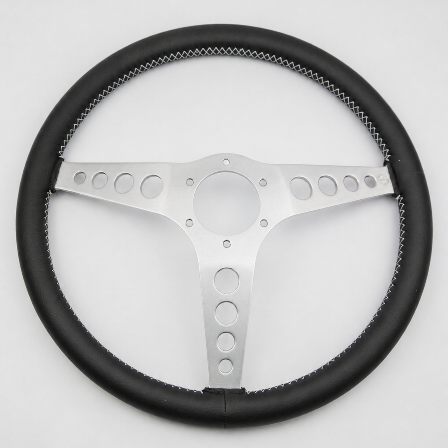 Rear view of a Les Leston 14-inch dished leather steering wheel showing mounting holes and spoke construction