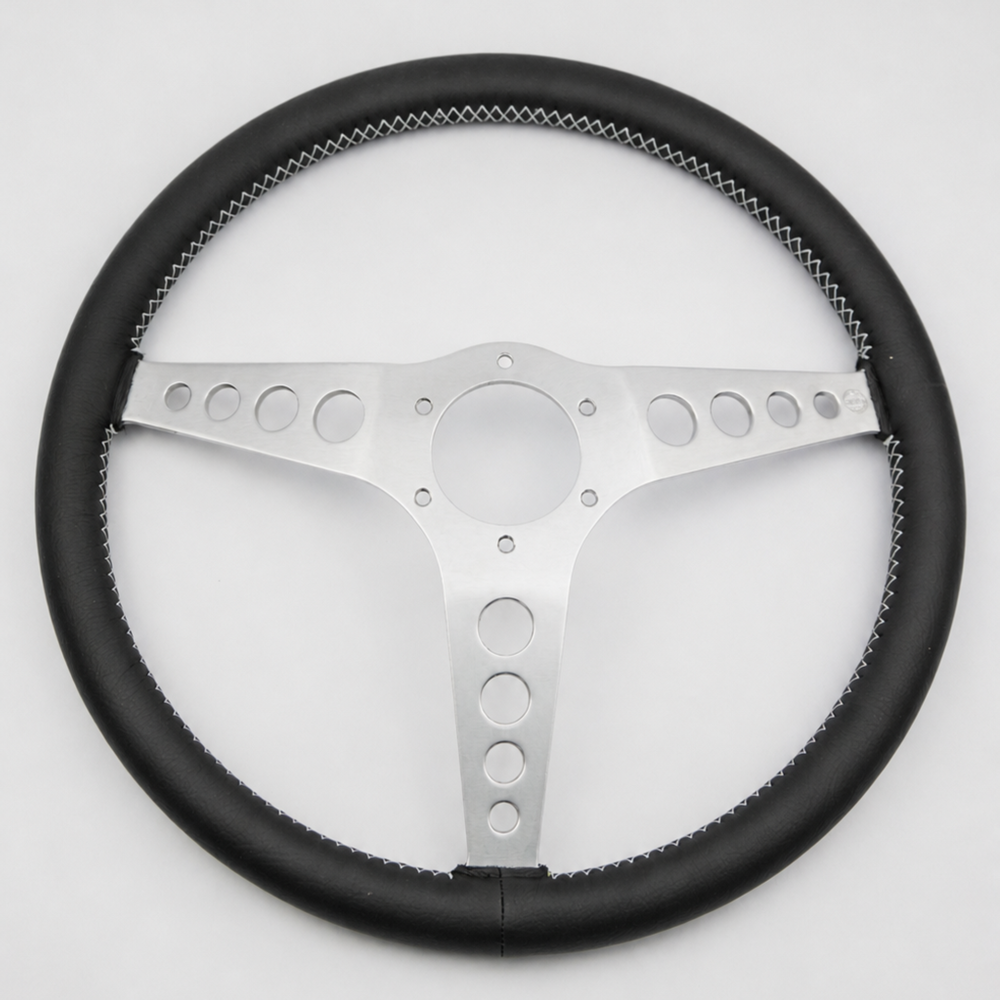 Rear view of a Les Leston 14-inch dished leather steering wheel showing mounting holes and spoke construction
