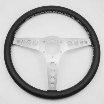 Rear view of a Les Leston 14-inch dished leather steering wheel showing mounting holes and spoke construction