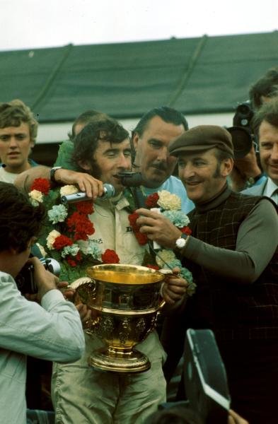Les Leston interviewing Jackie Stewart at the British Grand Prix during historic motorsport television coverage
