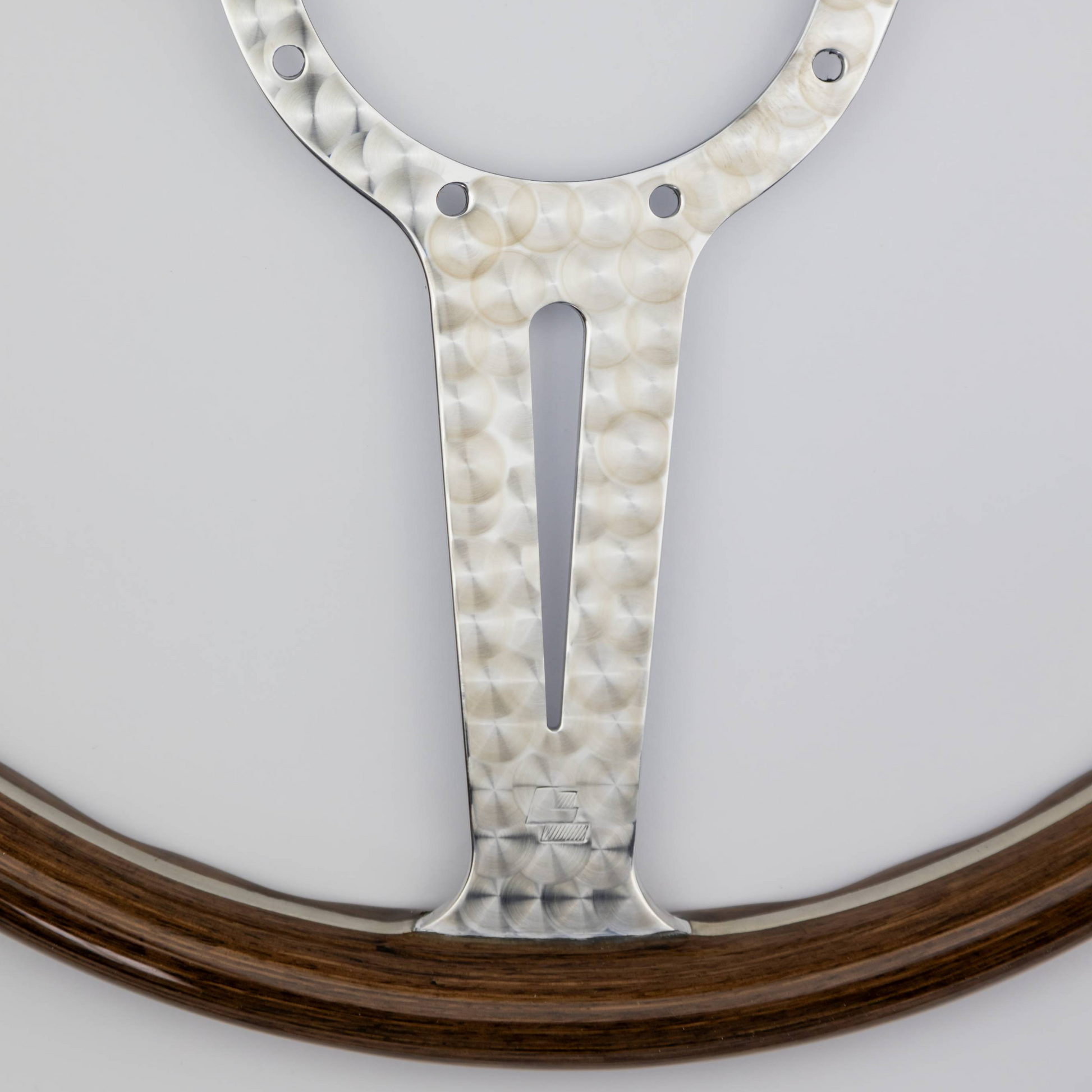 Close-up of the LL stamp on the engine turned aluminium frame of the Les Leston Monte Carlo steering wheel