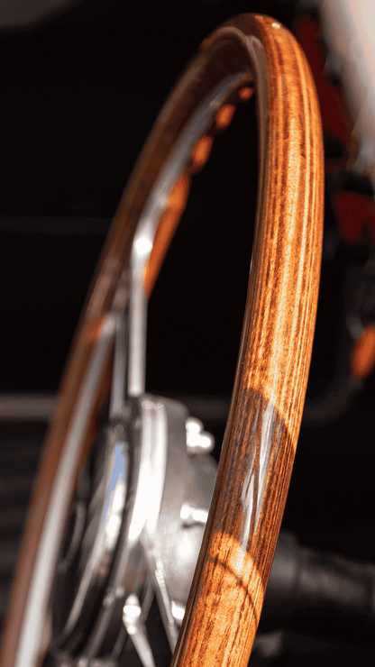 Les Leston Monte Carlo 14-inch flat steering wheel installed in classic car interior showing driving position and dashboard context
