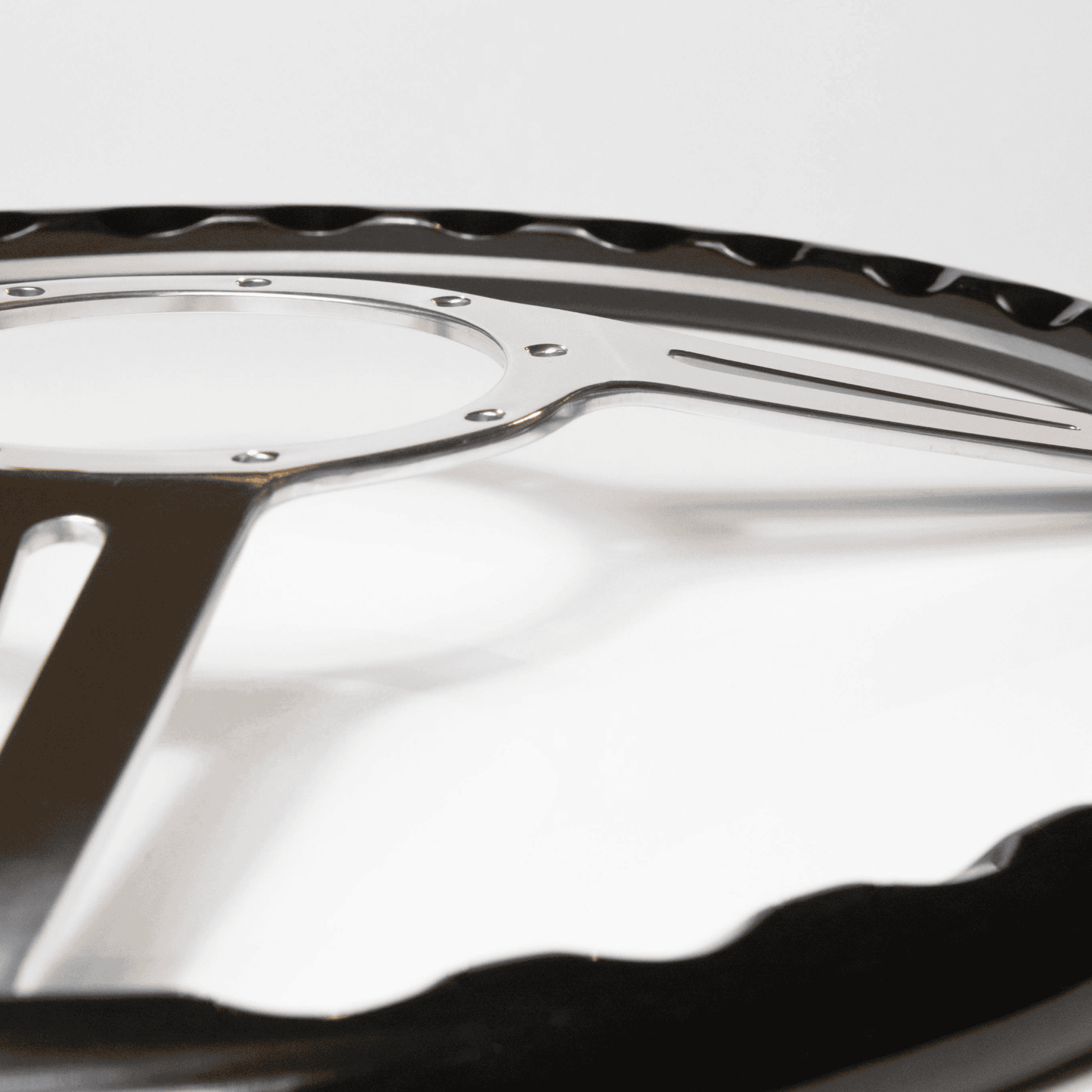 Close-up of black stained oak rim on Les Leston Monte Carlo 15-inch steering wheel showing wood grain finish