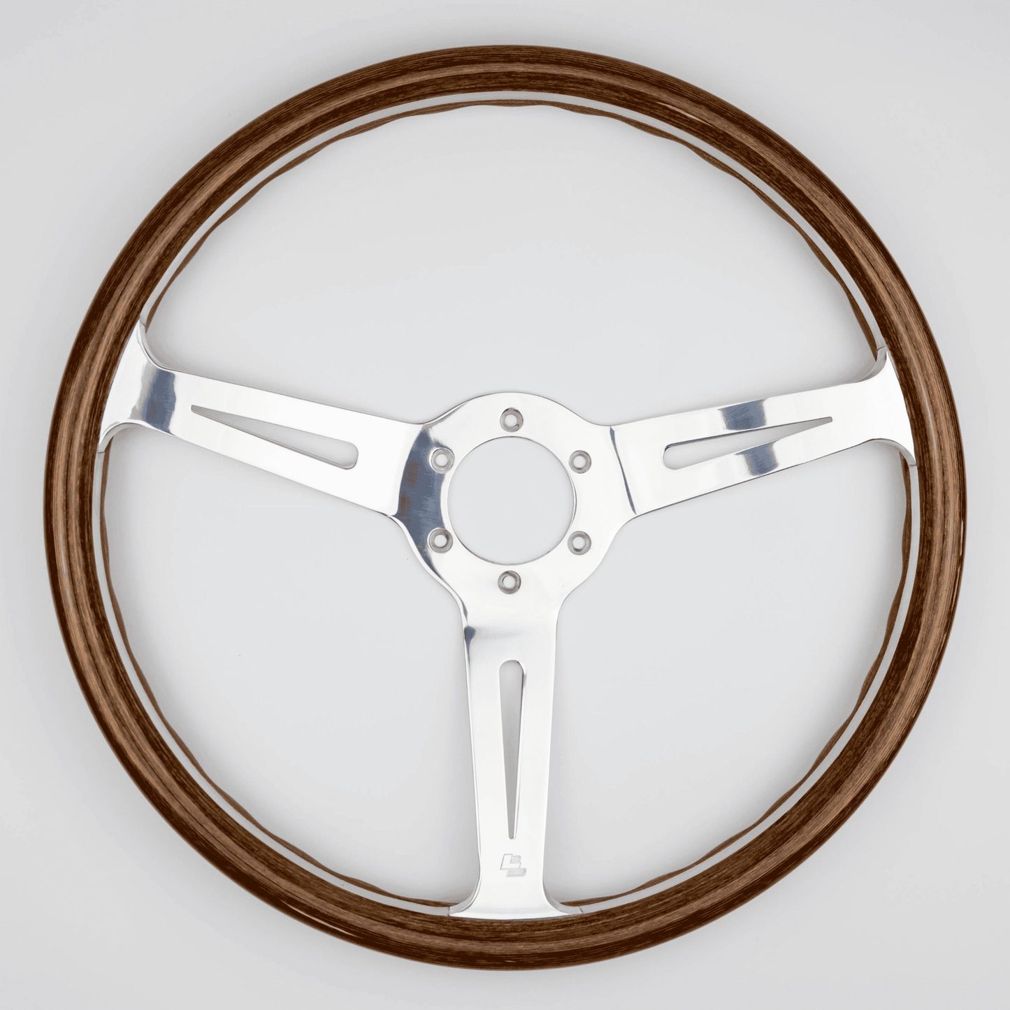 Front view of 15-inch Les Leston Monte Carlo steering wheel highlighting handcrafted wood rim and slotted aluminium spokes