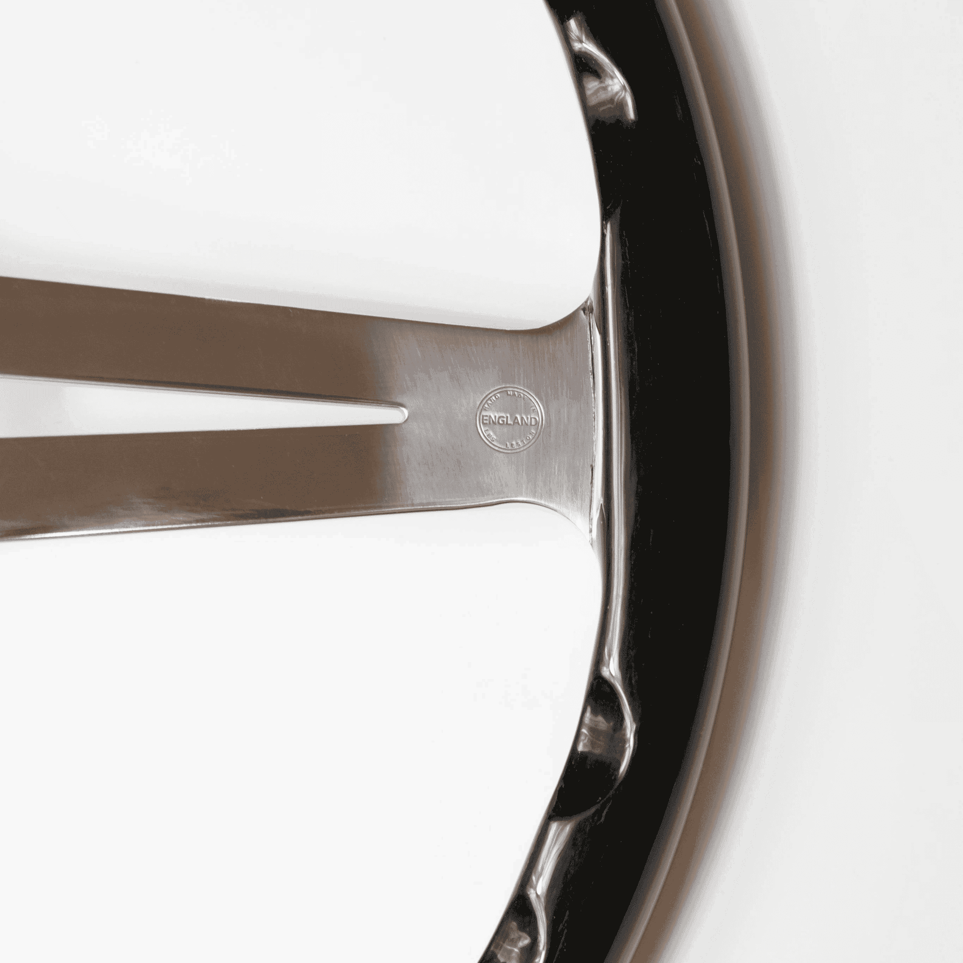 Close-up of Made in England stamp on Les Leston Monte Carlo 15-inch flat black oak steering wheel confirming British manufacture