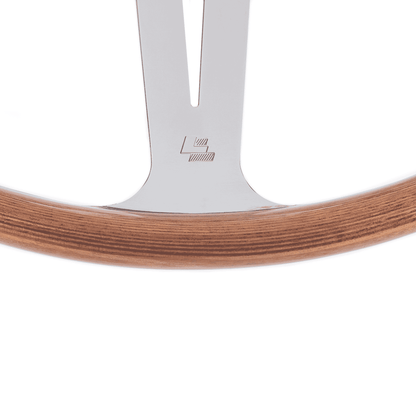 Close-up of Les Leston LL logo on 15-inch Monte Carlo flat mahogany steering wheel showing authentic maker’s mark detail
