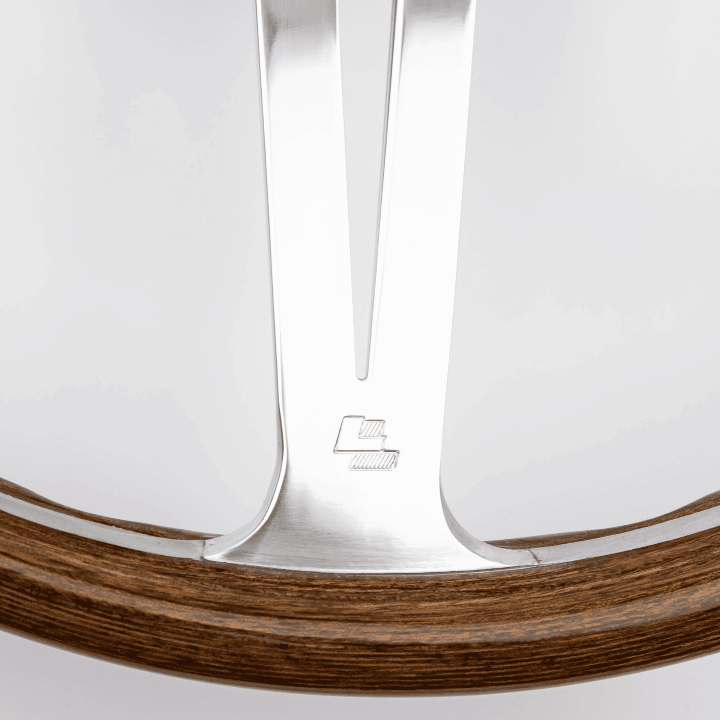 Close-up of Les Leston LL logo on 15-inch Monte Carlo steering wheel showing authentic maker's mark