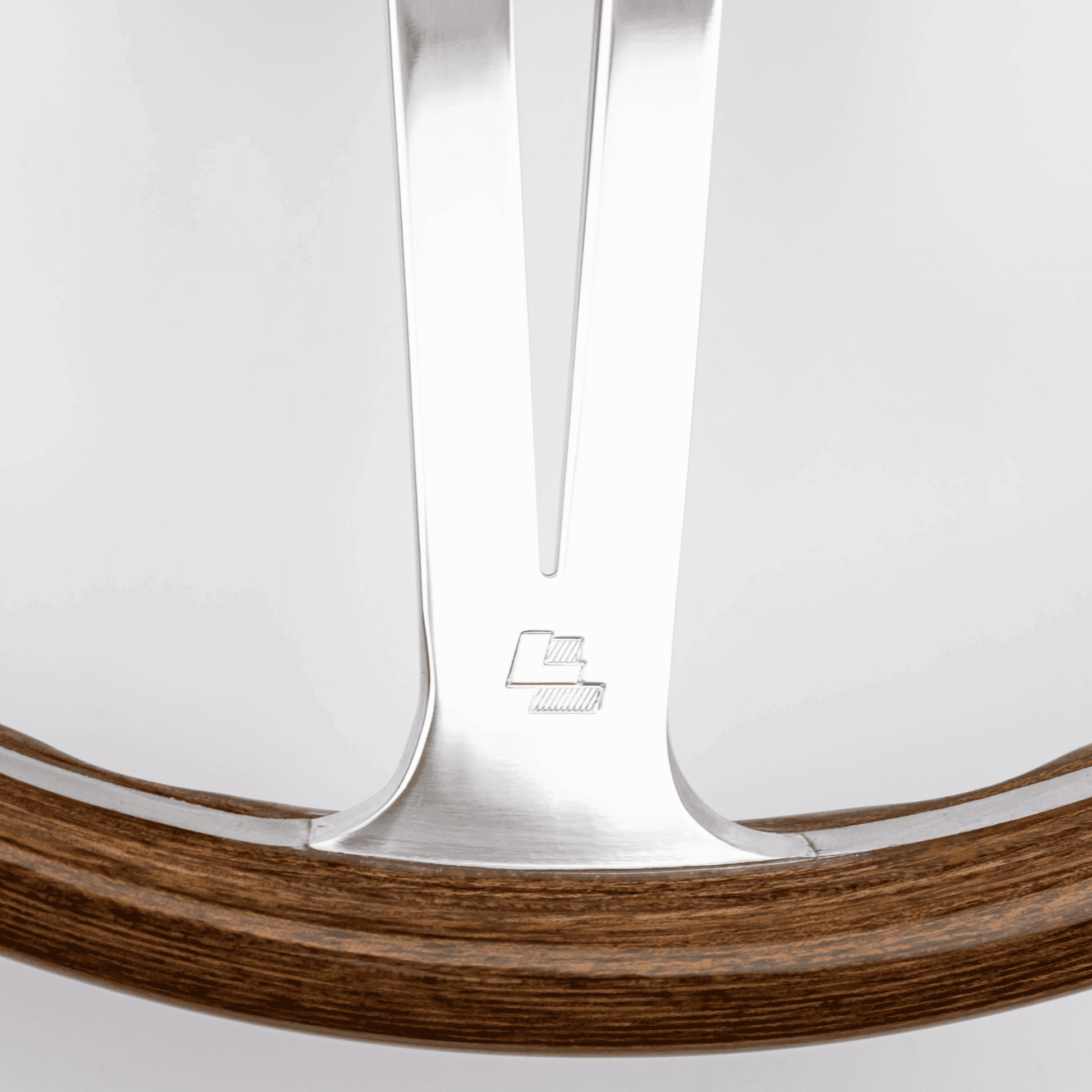 Close-up of Les Leston LL logo on 15-inch Monte Carlo steering wheel showing authentic maker's mark