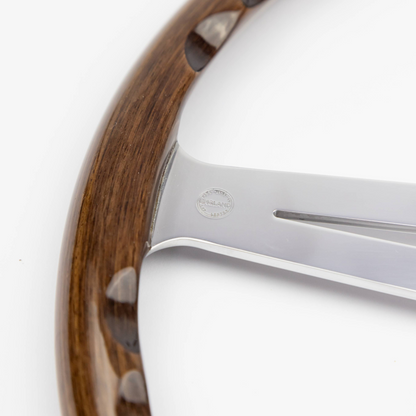 Close-up of the “Made in England” stamp on the walnut rim of a Les Leston Monte Carlo 15-inch steering wheel