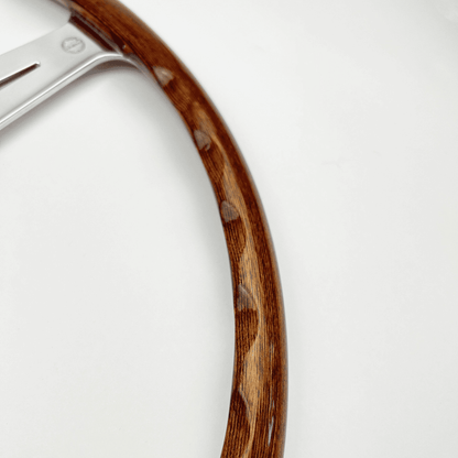 Rear view of Les Leston Monte Carlo 17-inch flat walnut steering wheel showing finger slot detailing and spoke construction
