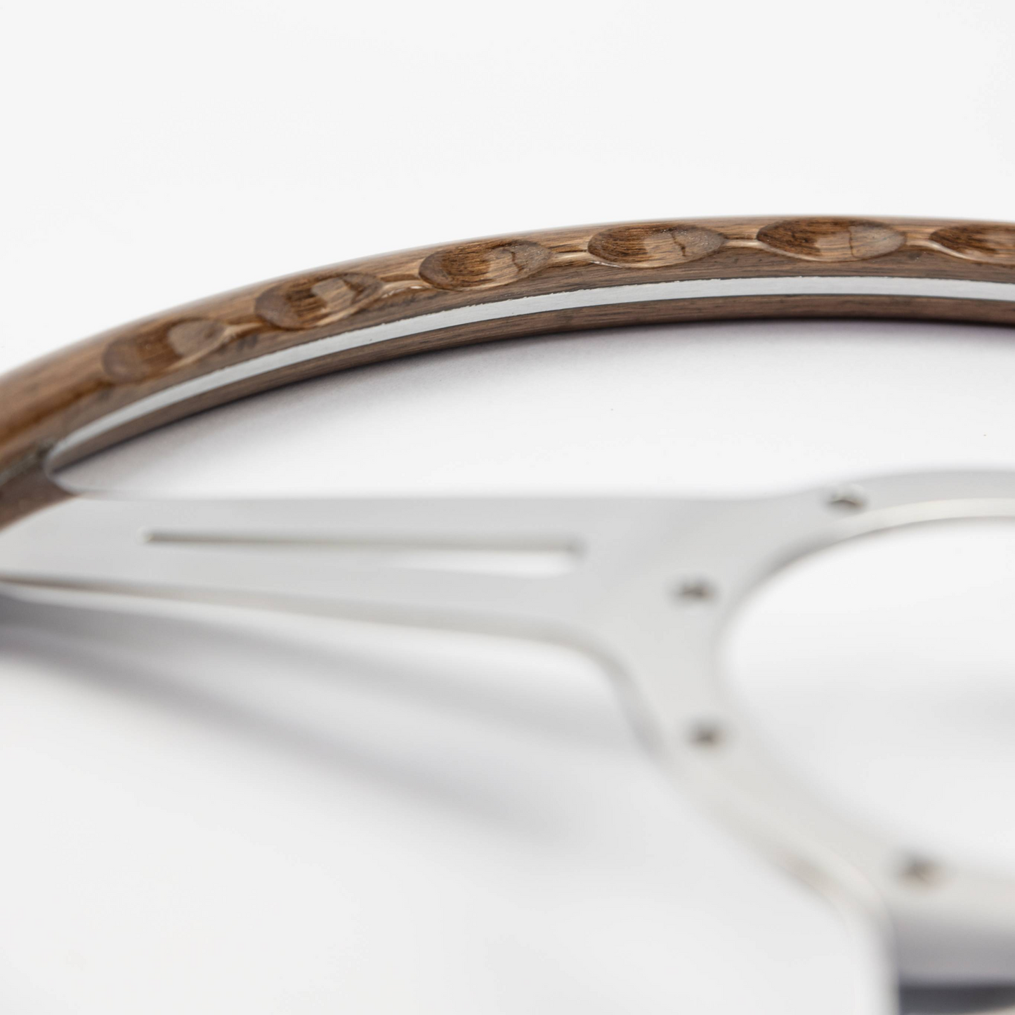 Close-up of finger slot detail on 15-inch Les Leston Monte Carlo walnut steering wheel