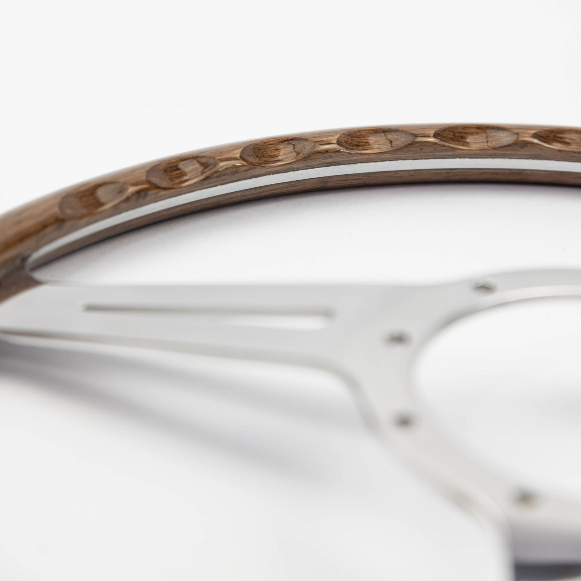 Close-up of finger slot detail on 15-inch Les Leston Monte Carlo walnut steering wheel