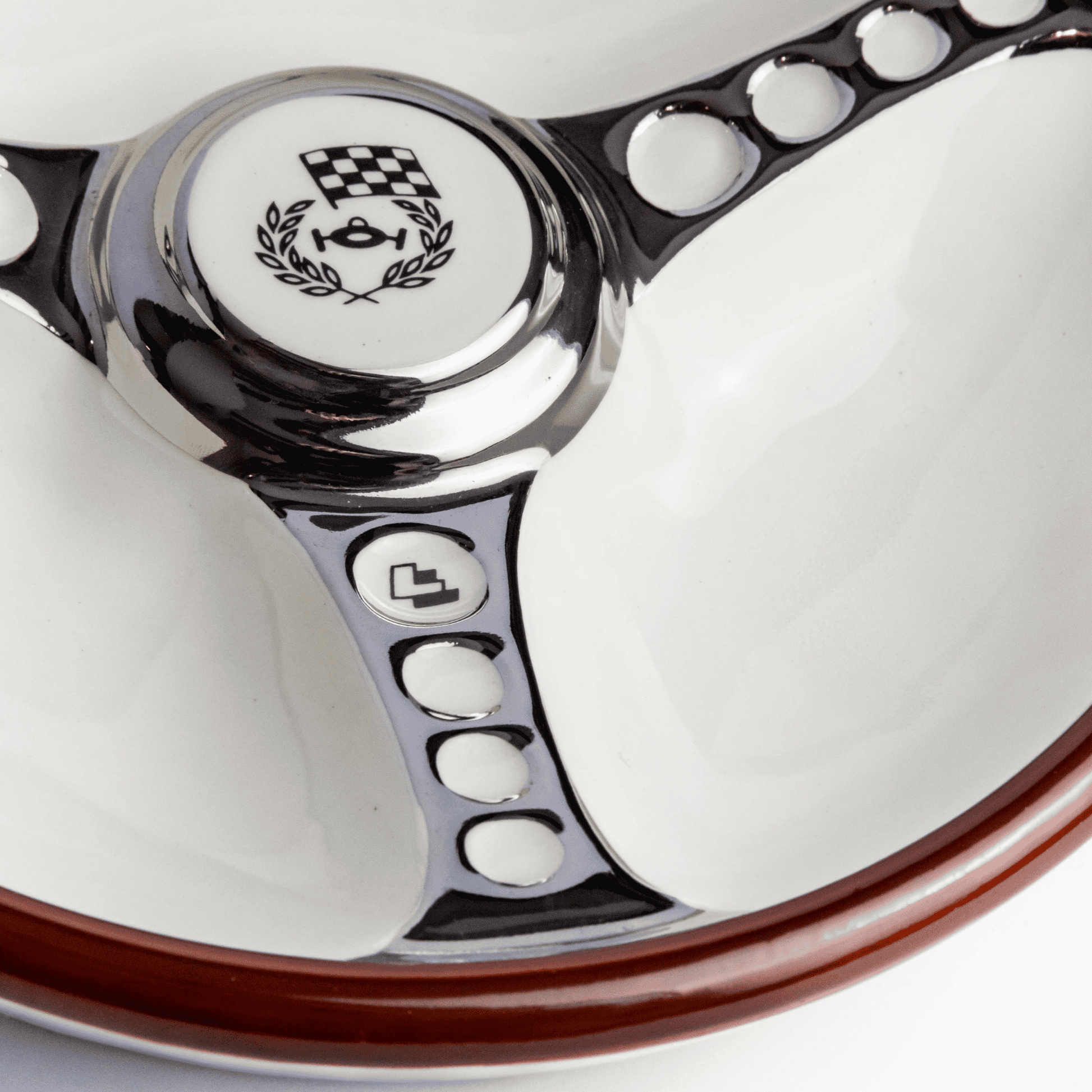 Close-up of Les Leston branding on steering wheel ashtray showing authentic manufacturer marking