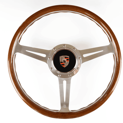 Porsche steering wheel boss hub with steering wheel fitted showing OEM horn button compatibility and installed cockpit view